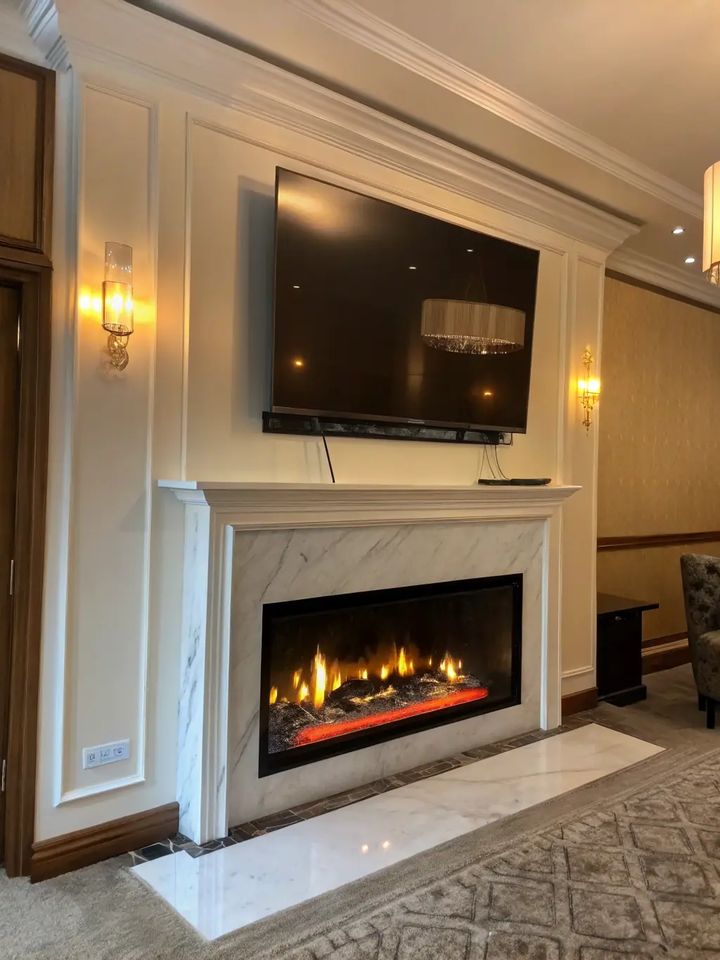 A close-up shot of a perfectly concealed cable setup behind a wall-mounted TV, showcasing a clean and modern living room aesthetic. The focus is on the seamless integration of the cables.